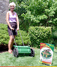 woman with garden tool and granular repellent